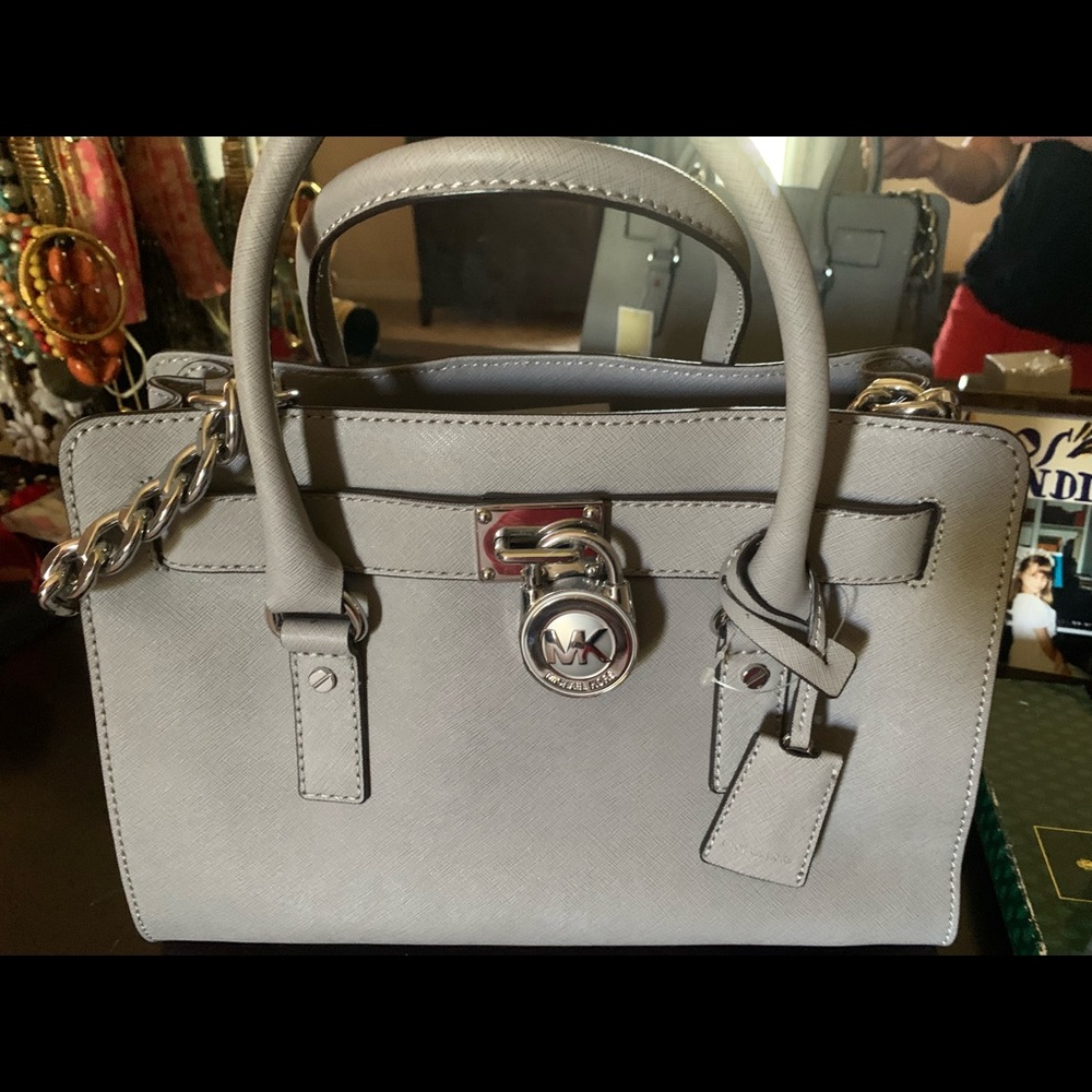 Brand new with tags Michael Kors purse.